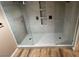 Modern shower with frameless glass and gray patterned tiling at 7904 Greycrest Ct # 104, Las Vegas, NV 89145