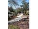 The property features scenic walkways with lush landscaping and mature trees at 7904 Greycrest Ct # 104, Las Vegas, NV 89145