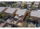 Aerial view of the backyard features a cozy patio area, spiral staircase, and fenced-in yard at 8008 Draco Cir # 201, Las Vegas, NV 89128