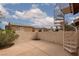 This private backyard features a metal spiral staircase leading to the upper level at 8008 Draco Cir # 201, Las Vegas, NV 89128