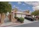 Charming two-story home featuring a two-car garage, neutral color scheme, and desert landscaping at 8008 Draco Cir # 201, Las Vegas, NV 89128