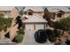 Charming home featuring a two-car garage, desert landscaping, and a neutral color scheme at 8008 Draco Cir # 201, Las Vegas, NV 89128