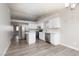 Modern kitchen with white cabinets, stainless steel appliances, and wood floors at 8008 Draco Cir # 201, Las Vegas, NV 89128