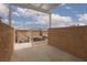 A private patio with a modern pergola offers a space to relax outside at 8008 Draco Cir # 201, Las Vegas, NV 89128