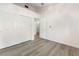 Bedroom showcasing wood-look floors and a closet with sliding doors at 8113 Dolphin Landing Dr, Las Vegas, NV 89128