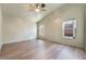 Spacious bedroom featuring hardwood flooring, multiple windows, and a ceiling fan at 8113 Dolphin Landing Dr, Las Vegas, NV 89128