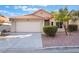 Charming single-story home with a two-car garage and desert landscaping for easy care at 8113 Dolphin Landing Dr, Las Vegas, NV 89128