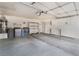 Spacious garage with laundry, cabinets, shelving, storage, and work area at 8113 Dolphin Landing Dr, Las Vegas, NV 89128