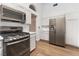 Spacious kitchen featuring stainless steel appliances, ample cabinet space, and a refrigerator at 8113 Dolphin Landing Dr, Las Vegas, NV 89128
