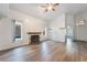 Bright living room features wood-look floors and a fireplace at 8113 Dolphin Landing Dr, Las Vegas, NV 89128