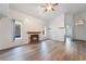 Bright living room features wood-look floors and a fireplace at 8113 Dolphin Landing Dr, Las Vegas, NV 89128