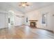 Spacious living room features wood-look floors and a fireplace at 8113 Dolphin Landing Dr, Las Vegas, NV 89128