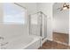 This bright bathroom features a tub and a shower at 820 Wintersweet Rd, Henderson, NV 89015