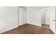 Bright room features brown tile flooring and two white doors at 820 Wintersweet Rd, Henderson, NV 89015