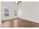 Well-lit bedroom with two windows and neutral flooring at 820 Wintersweet Rd, Henderson, NV 89015