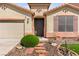 Charming single-story home with desert landscaping and a cozy entrance featuring a decorative front door at 820 Wintersweet Rd, Henderson, NV 89015