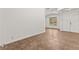 Bright living room with tile flooring, large windows, and a double-door entrance at 820 Wintersweet Rd, Henderson, NV 89015