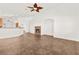 Open-concept living room with tile flooring and a cozy fireplace, perfect for relaxation and gatherings at 820 Wintersweet Rd, Henderson, NV 89015