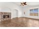 Inviting living room with tiled floors, fireplace, and ample natural light at 820 Wintersweet Rd, Henderson, NV 89015