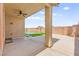 Covered patio looking out to a swimming pool and artificial grass at 820 Wintersweet Rd, Henderson, NV 89015