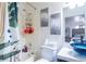 Bright bathroom with a tub, shower, modern vanity with unique glass bowl, and decorative wall art at 8410 Eldora Ave # 2067, Las Vegas, NV 89117