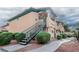 Inviting two-story home with desert landscaping and a private entrance staircase at 8410 Eldora Ave # 2067, Las Vegas, NV 89117