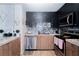 Modern kitchen features granite countertops, stainless steel appliances and stylish tile backsplash at 8410 Eldora Ave # 2067, Las Vegas, NV 89117