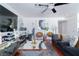 Bright living room offering a comfortable seating area, home office, and modern decor at 8410 Eldora Ave # 2067, Las Vegas, NV 89117