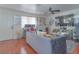 Comfortable living room with modern décor, a home office setup, and ample natural light at 8410 Eldora Ave # 2067, Las Vegas, NV 89117