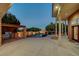 Spacious backyard featuring an outdoor kitchen, pool, and lush landscaping for a private, relaxing oasis at 8470 S Pioneer Way, Las Vegas, NV 89113