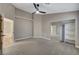 Spacious bedroom with walk-in closet and neutral color scheme, perfect for relaxation at 8470 S Pioneer Way, Las Vegas, NV 89113
