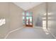 Bright bedroom featuring vaulted ceilings and a walk-out to a beautiful backyard at 8470 S Pioneer Way, Las Vegas, NV 89113