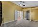 Comfortable bedroom with built-in shelving and walk-in closet, ceiling fan and soft carpet at 8470 S Pioneer Way, Las Vegas, NV 89113