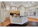 Bright kitchen featuring terracotta floors, granite countertops, and bar seating at 8470 S Pioneer Way, Las Vegas, NV 89113