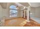Bright living area featuring hardwood floors, terracotta tile steps, and natural light at 8470 S Pioneer Way, Las Vegas, NV 89113