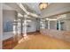 Open living space showcasing hardwood floors, terracotta tile steps, and glass brick accent at 8470 S Pioneer Way, Las Vegas, NV 89113