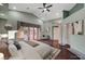 Comfortable bedroom features a ceiling fan, and a private door to the yard at 8470 S Pioneer Way, Las Vegas, NV 89113