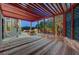 Covered patio with brick flooring and views of the backyard landscaping, ideal for outdoor entertaining or relaxing at 8470 S Pioneer Way, Las Vegas, NV 89113