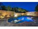 Luxury pool with unique features, lush landscaping, and elegant patio hardscape at 8470 S Pioneer Way, Las Vegas, NV 89113