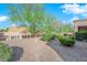 Well-maintained backyard with gravel and shrubbery at 8620 Prairie Hill Dr, Las Vegas, NV 89134