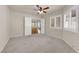 Spacious bedroom featuring carpet floors, neutral walls, and wide double door entry at 8620 Prairie Hill Dr, Las Vegas, NV 89134