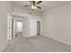 Neutral bedroom with carpet, and ceiling fan, with a view to other rooms at 8620 Prairie Hill Dr, Las Vegas, NV 89134