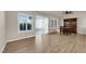 Bright dining area with hardwood floors, large windows, and a glass sliding door at 8620 Prairie Hill Dr, Las Vegas, NV 89134