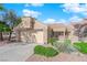 Charming single-story home featuring a well-manicured front yard and a two-car garage at 8620 Prairie Hill Dr, Las Vegas, NV 89134