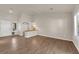 Bright living room with hardwood floors, neutral paint, and a double door entrance at 8620 Prairie Hill Dr, Las Vegas, NV 89134