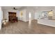 Open living area with hardwood floors, neutral walls, and an adjacent dining area at 8620 Prairie Hill Dr, Las Vegas, NV 89134