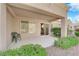 Covered patio with ample space for outdoor seating and entertainment, enhanced by desert landscaping at 8620 Prairie Hill Dr, Las Vegas, NV 89134