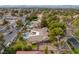 Beautiful aerial view of the property showcasing the backyard, sparkling pool, and lush landscaping at 9 Quail Run Rd, Henderson, NV 89014