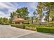 Elegant entrance to Quail Ridge Estates with manicured landscaping and a welcoming gatehouse at 9 Quail Run Rd, Henderson, NV 89014