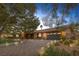 Well-maintained brick home showcasing desert landscaping and brick-paved driveway at 9 Quail Run Rd, Henderson, NV 89014